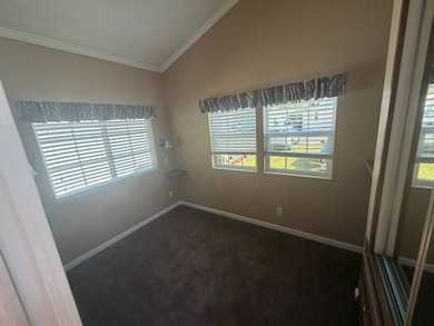 This 2-bedroom, 1-bathroom mobile home offers a modern - photo 3