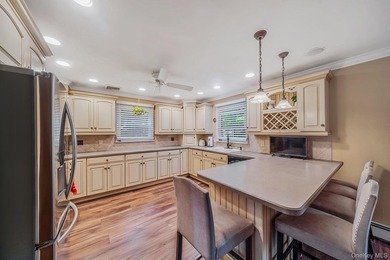 Nestled on a beautifully landscaped property surrounded by - photo 11