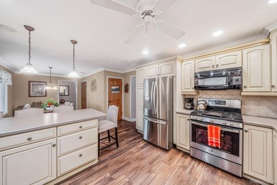 Nestled on a beautifully landscaped property surrounded by - photo 13