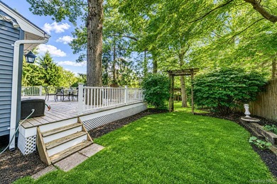 Nestled on a beautifully landscaped property surrounded by - photo 29