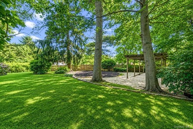 Nestled on a beautifully landscaped property surrounded by - photo 30