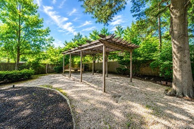 Nestled on a beautifully landscaped property surrounded by - photo 31