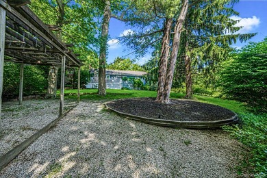 Nestled on a beautifully landscaped property surrounded by - photo 32