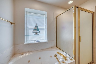 This charming waterfront retreat is perfectly positioned on a