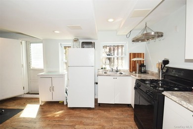 Welcome to this beautifully renovated semi-detached home in the - photo 15