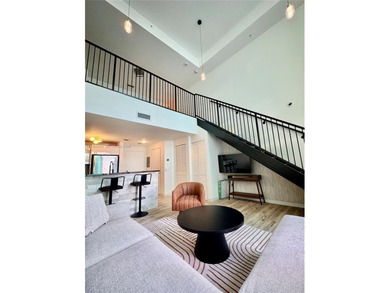 Wake up to water views and natural light pouring through 20-foot