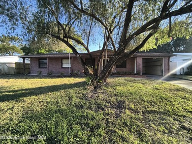 Unlock the potential of this 3-bedroom, 2-bathroom home nestled - photo 1