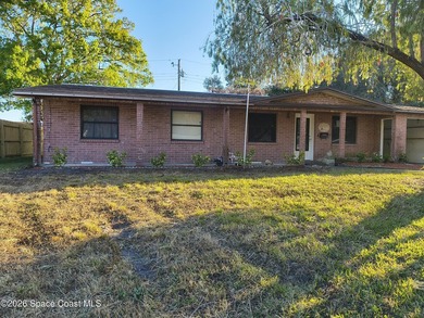 Unlock the potential of this 3-bedroom, 2-bathroom home nestled - photo 2