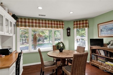 This exceptionally updated, one-level end unit on the lagoon is - photo 11