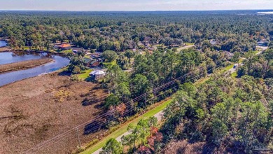 Nestled on nearly half an acre of serene waterfront property - photo 12