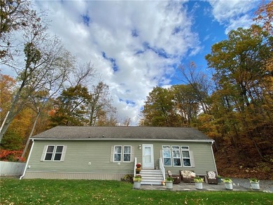 Nestled along the serene shores of Seneca Lake, this ranch - photo 1