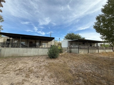 This 4.3 acre fenced property with Frio River frontage, a - photo 4