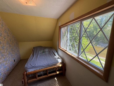Nestled along the beautiful Rifle River, this charming - photo 17