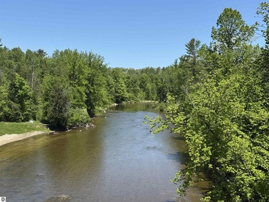Nestled along the beautiful Rifle River, this charming - photo 19