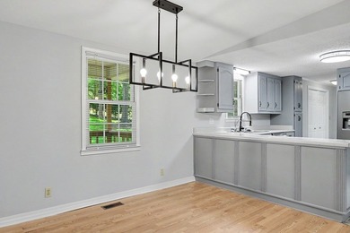 Charming 3 bedroom 2 bath home nestled on the banks of beautiful - photo 22