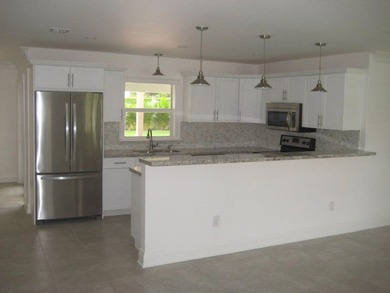 Welcome to this single-story residence in Boca Madera, located - photo 9