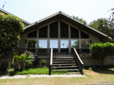 Stunning waterfront retreat on a gently sloping 0.64-acre lot - Lake Home For Sale in Lakehills, Texas