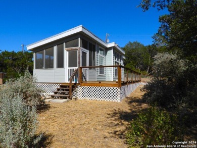 Absolutely charming tiny home! Bright and breezy, this space is - Lake Home For Sale in Lakehills, Texas