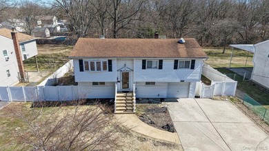Welcome to 1081 Bay Shore Ave, a spacious Hi-Ranch home offering - photo 2