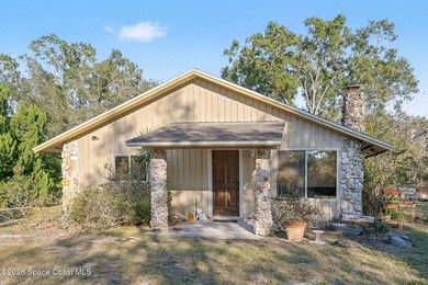 Set on 4.62 acres along a paved road, this 3BR/2BA country home - photo 2