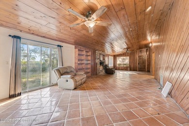 Set on 4.62 acres along a paved road, this 3BR/2BA country home - photo 7