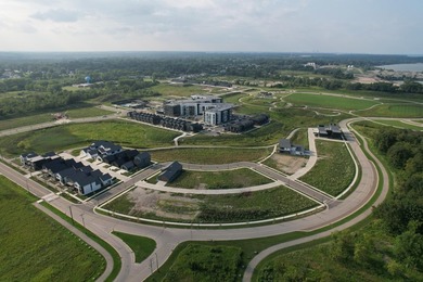 Welcome to Lakeshore Commons! This vacant lot is located in one - photo 2