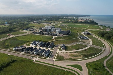 Welcome to Lakeshore Commons! This vacant lot is located in one - photo 3
