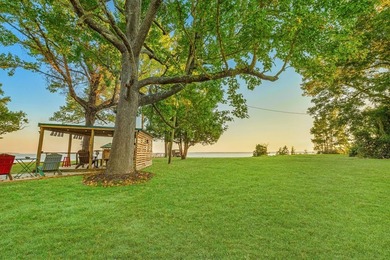 This rare 2-acre waterfront property captures one of the most - photo 16