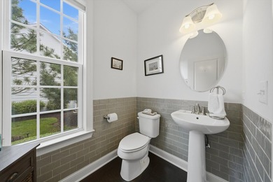 Set on a professionally landscaped lot of more than one-third - photo 15
