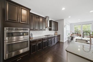Set on a professionally landscaped lot of more than one-third - photo 22