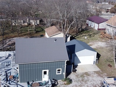 Enjoy lake views with this 1st tier property in Linn Valley - photo 32