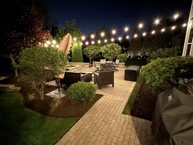 Set on a professionally landscaped lot of more than one-third - photo 48