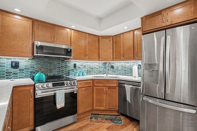 Just a short walk to the beach, this updated second-floor condo - photo 11