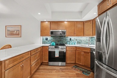 Just a short walk to the beach, this updated second-floor condo - photo 12