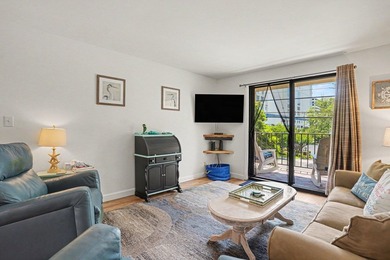 Just a short walk to the beach, this updated second-floor condo - photo 18