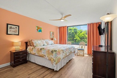 Just a short walk to the beach, this updated second-floor condo - photo 23
