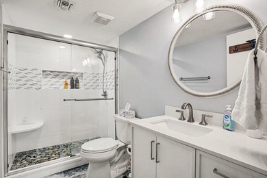 Just a short walk to the beach, this updated second-floor condo - photo 25