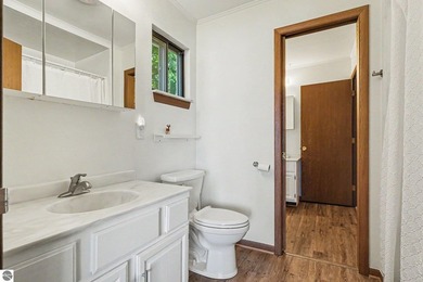 Nestled on 99 feet of Van Ettan Lake frontage and surrounded by - photo 12