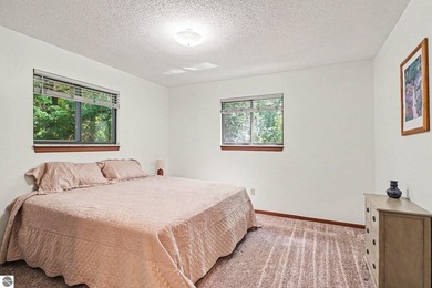Nestled on 99 feet of Van Ettan Lake frontage and surrounded by - photo 13