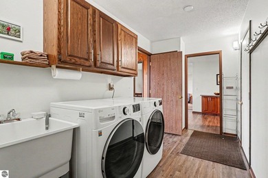 Nestled on 99 feet of Van Ettan Lake frontage and surrounded by - photo 15