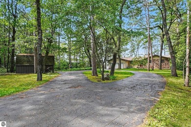Nestled on 99 feet of Van Ettan Lake frontage and surrounded by - photo 28