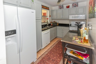 Top-Floor Condo with Serene Lake Views in Gated 55+ Golden Lakes - photo 9