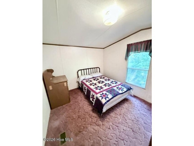 Singlewide home sitting on 1.45 +/- unrestricted acres! Nestled - photo 11