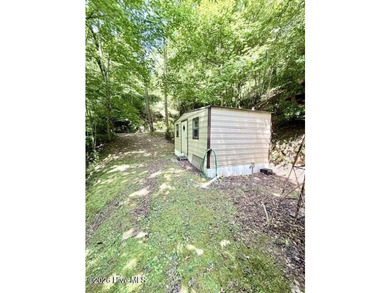 Singlewide home sitting on 1.45 +/- unrestricted acres! Nestled - photo 13