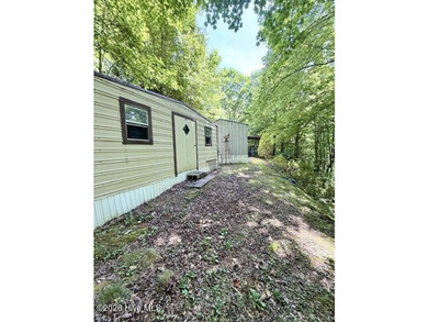 Singlewide home sitting on 1.45 +/- unrestricted acres! Nestled - photo 14
