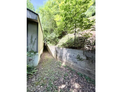 Singlewide home sitting on 1.45 +/- unrestricted acres! Nestled - photo 15