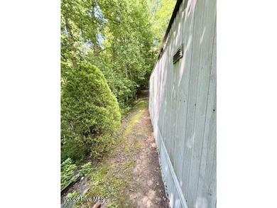 Singlewide home sitting on 1.45 +/- unrestricted acres! Nestled - photo 16
