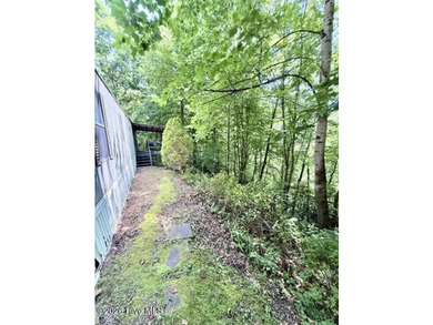 Singlewide home sitting on 1.45 +/- unrestricted acres! Nestled - photo 18