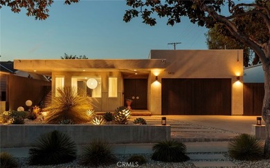 Welcome to a striking architectural residence in the highly - photo 1