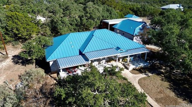 Gated Hill Country property on nearly 5 acres in the highly - photo 1